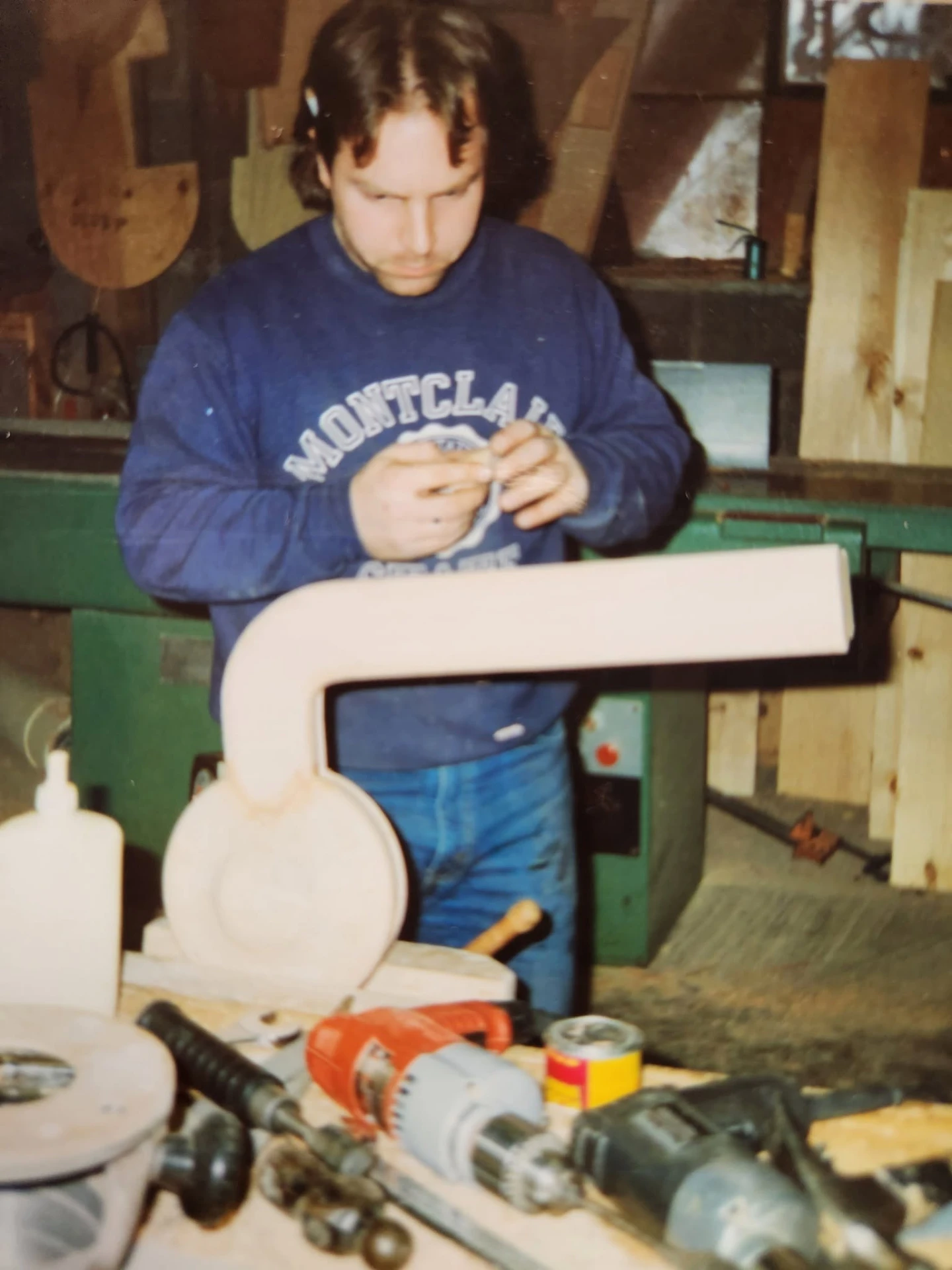 Shaping a stair fitting at the workbench